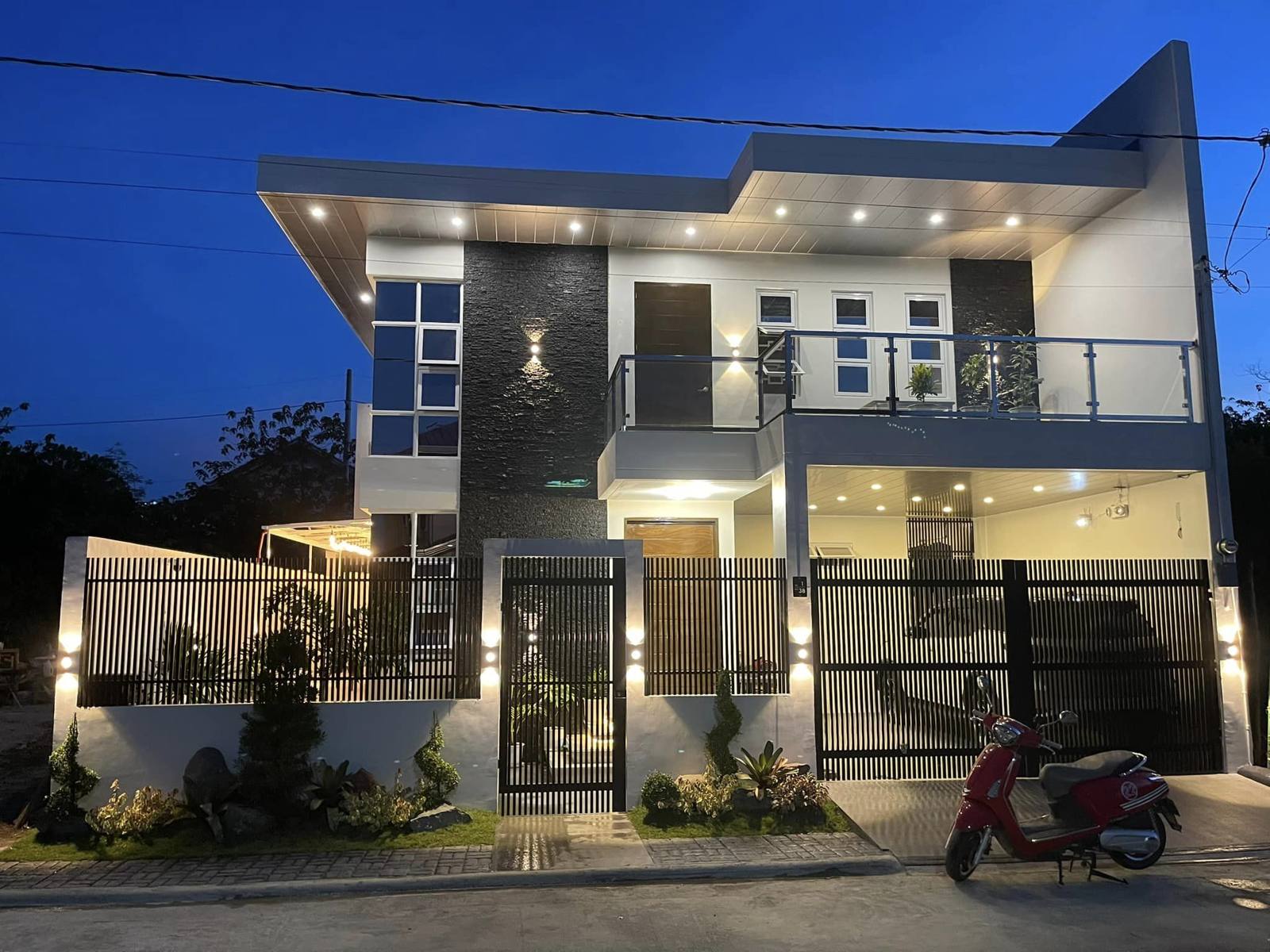 Finished two-storey home lit at dusk